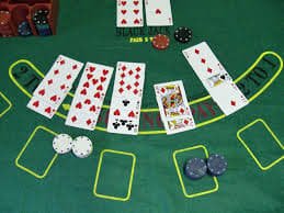 Mobile phone displaying live baccarat table with dealer